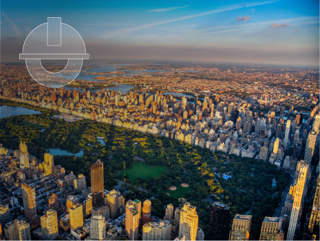 Aerial view of Central Park bordered by the buildings of Manhattan, New York City. Gradient overlay on top of image with engineering icon.