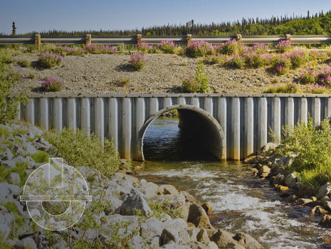 Creek and culvert along a highway.