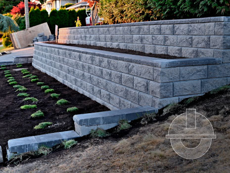 A two tier retaining block wall incorporated into an existing garden landscape designed to suit to home owners needs.