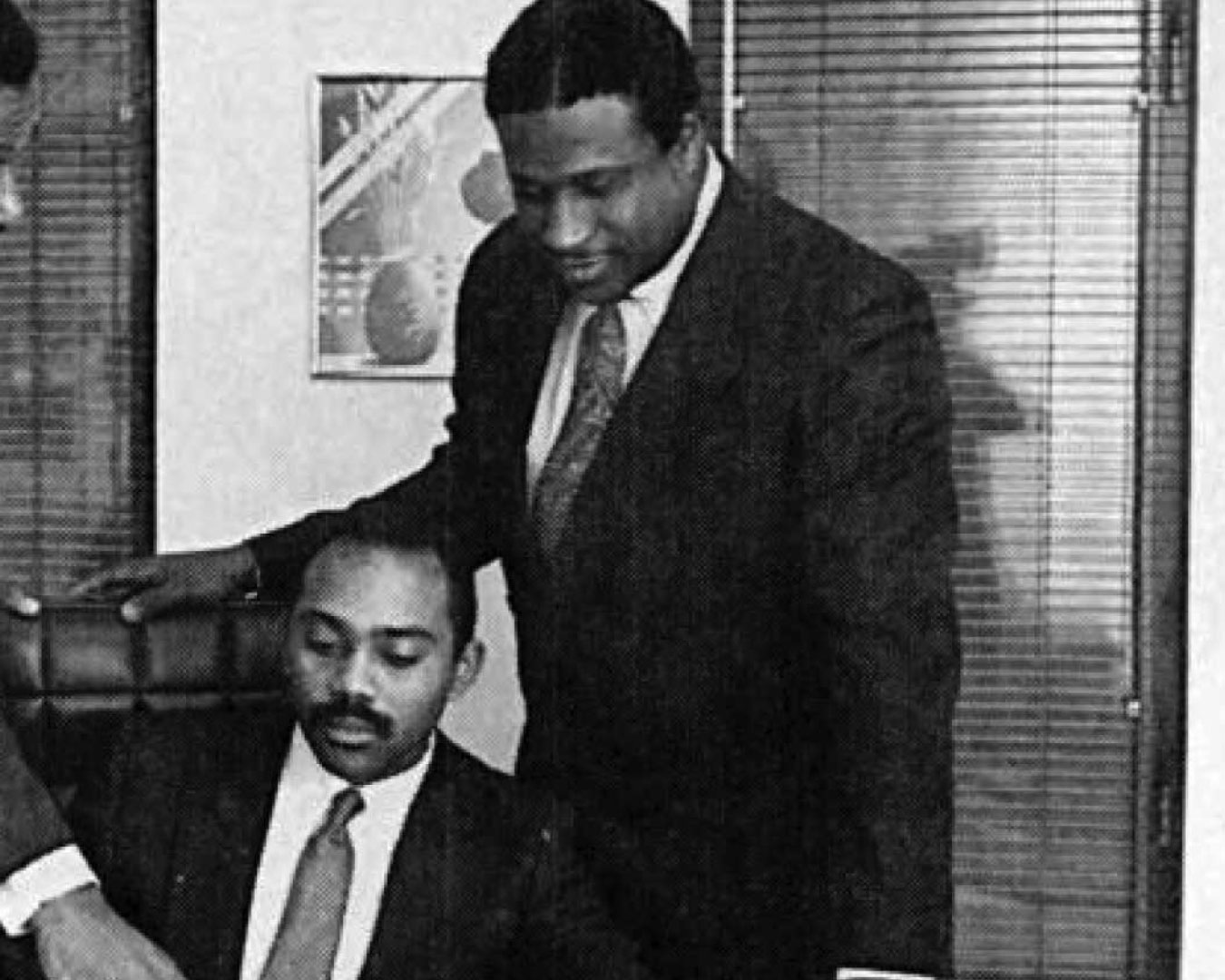UTRS founders Lamont McLean (seated) and Gerry Wright (right), with Lloyd Booker, UTRS VP of Technical Services, in 1987.
