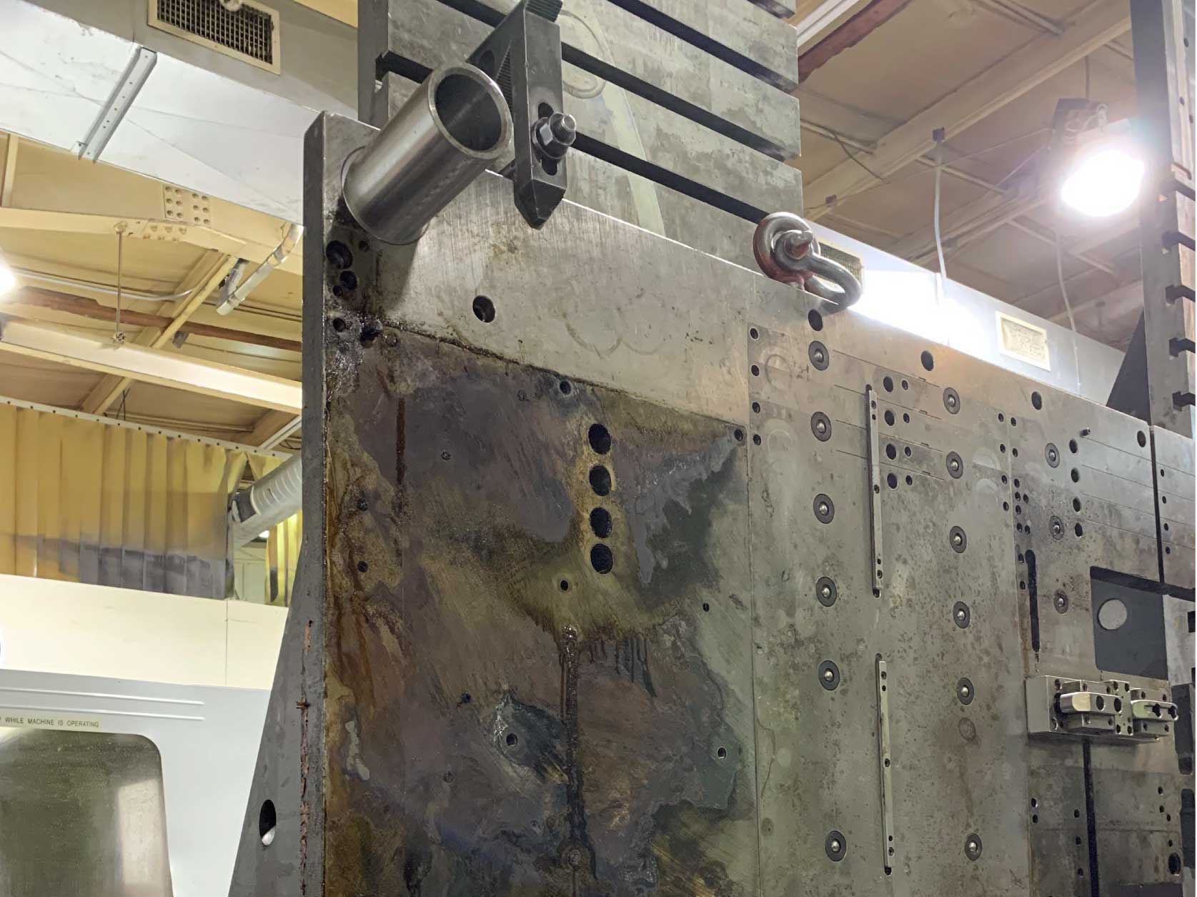 New guide bushing installed in a 4-ft wide by 8-ft long by 2-inches thick progress die set piece that weighs about 3,000 pounds.