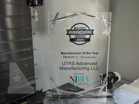 UTRS Advanced Manufacturing, LLC award for 2025 ‘MADE in New Jersey’ Manufacturing Day Manufacturer of the Year – MEDIUM award. Award is placed on manufacturing machine.