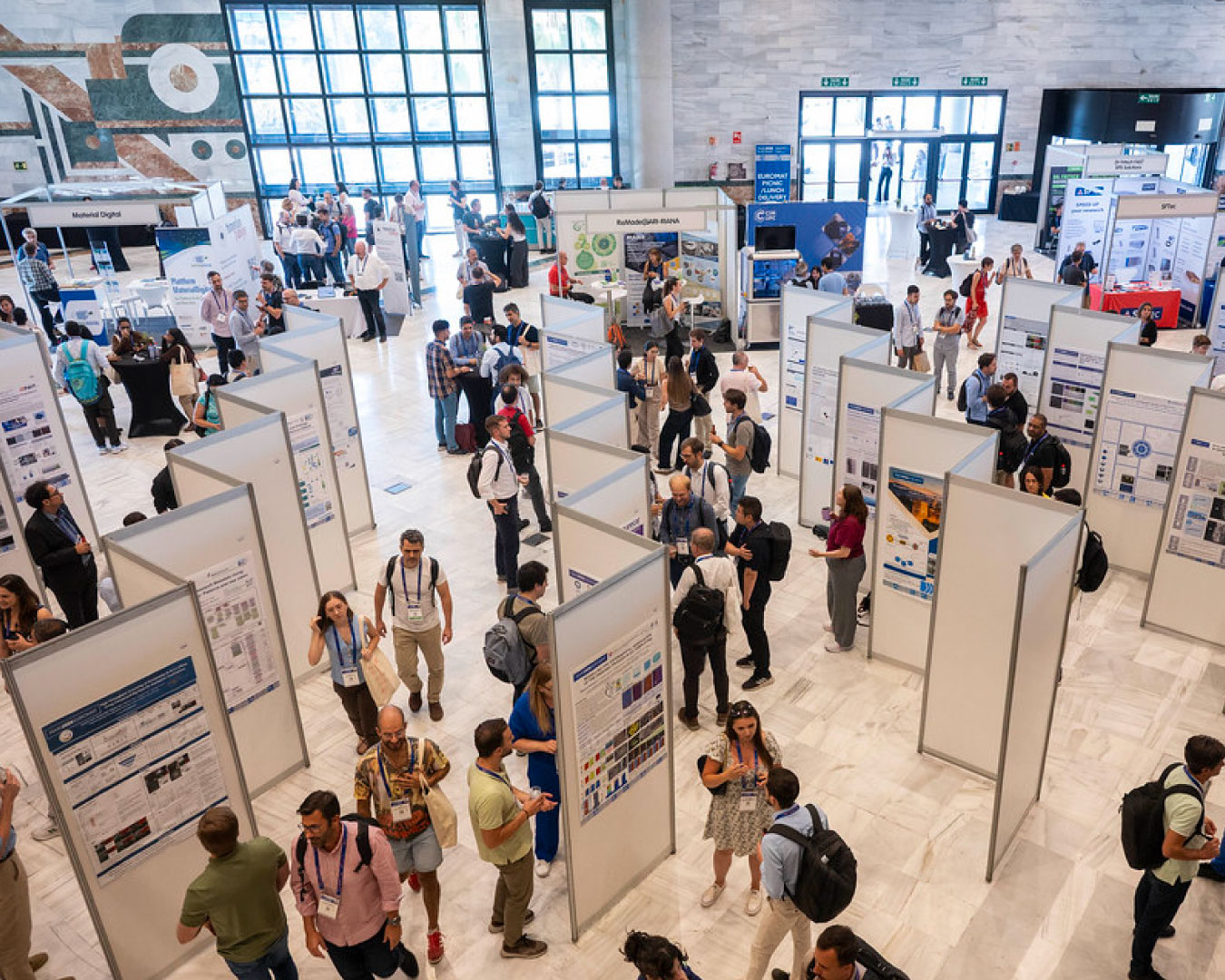 View od poster session during the EUROMAT 2025 conference. Image is from SOCIEMAT Sociedad Española de Materiales flickr account (ambiente_35)