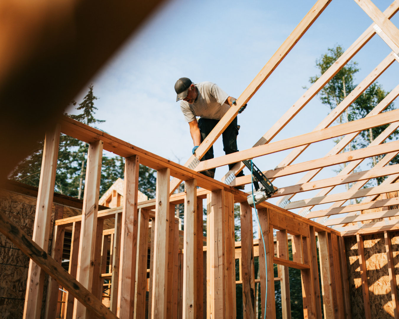 Construction Crew Putting Up Framing of New Home