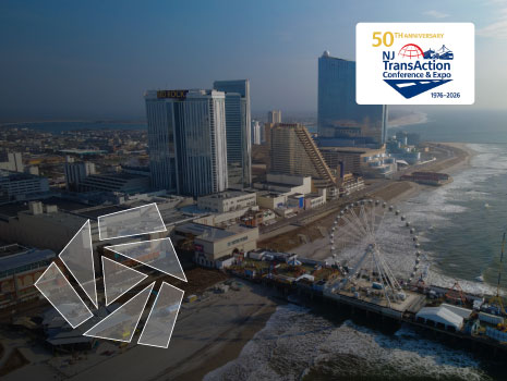 Aerial shot along boardwalk and shore in Atlantic City, NJ with 50th anniversary TransAction logo and UTRS shield icon.