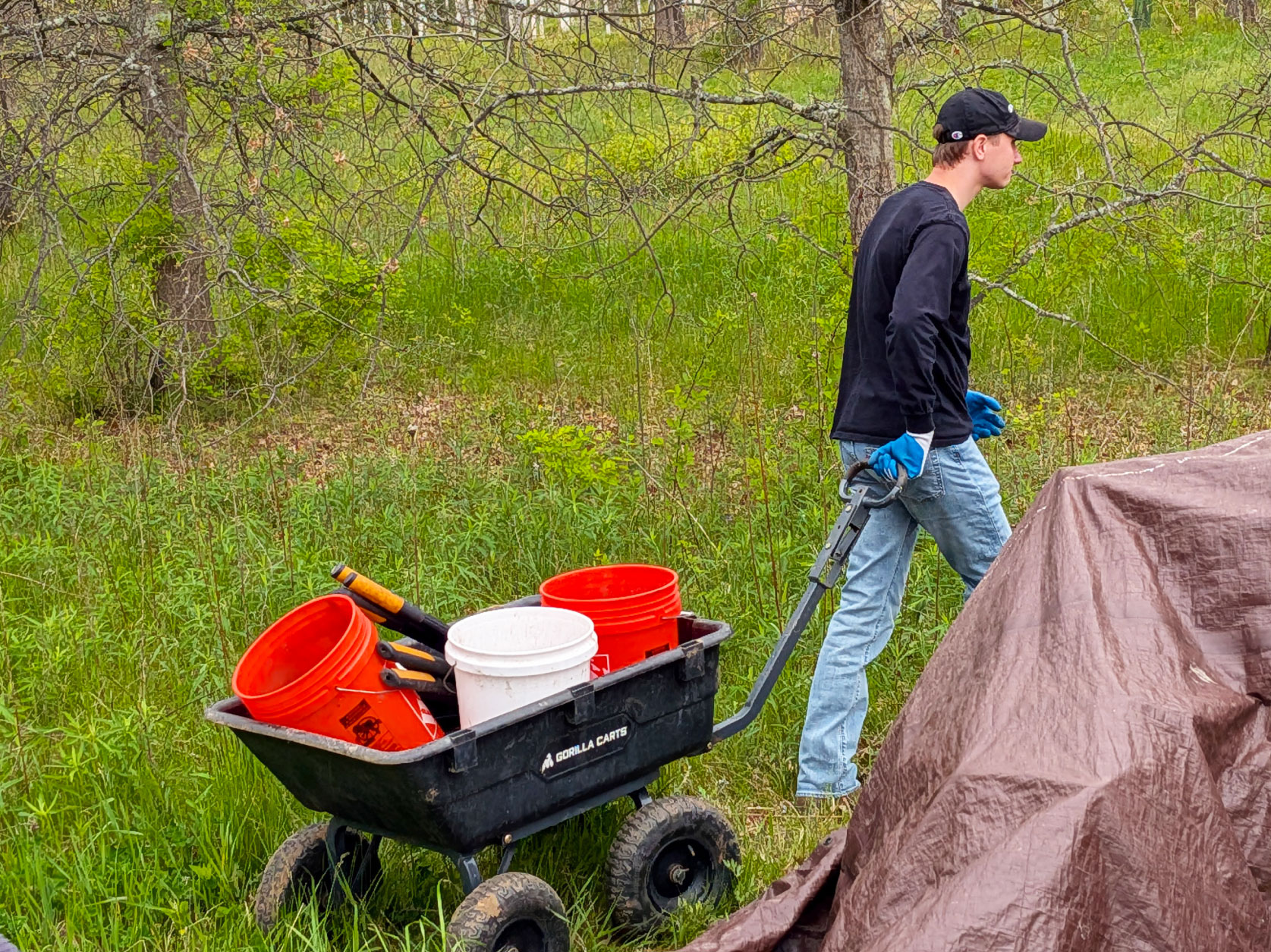 UTRS volunteer hauling cleanup and maintenance materials to the day’s work site