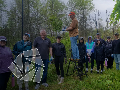 UTRS volunteers supporting outdoor stewardship at the Watershed Institute. Overlay of UTRS Charitable Fund icon on bottom left of image.