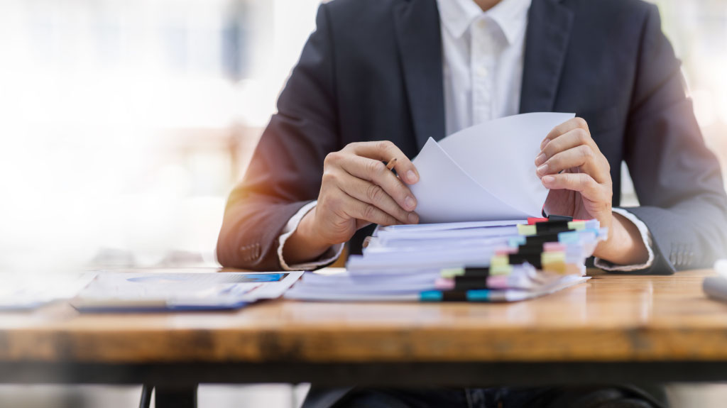 Business accountant document legal, Auditor businesswoman Office employee working with documents at the table workplace, closeup