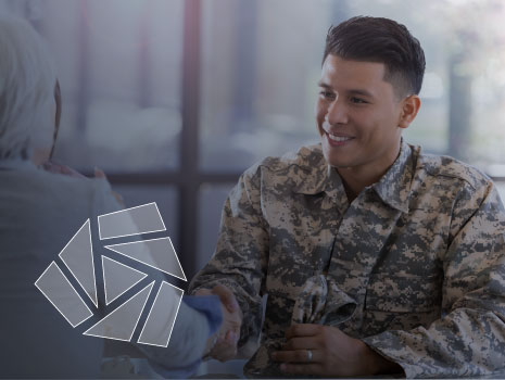 Military member shaking hands with female interviewer